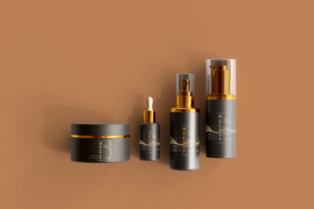 3 black and gold spray bottles